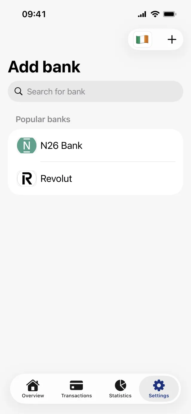 The Add bank screen with a search field, N26 Bank and Revolut under Popular banks, and the flag button in the top right