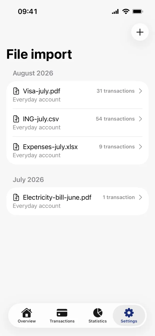 The File import screen with past imports grouped by month and the plus button in the top right